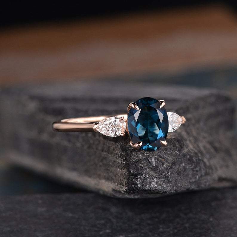 Premium Photo | A blue diamond ring with a diamond ring on a blue  background.